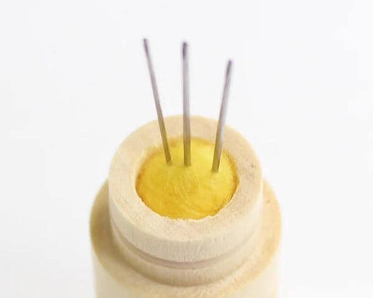a white container with a yellow substance inside of it