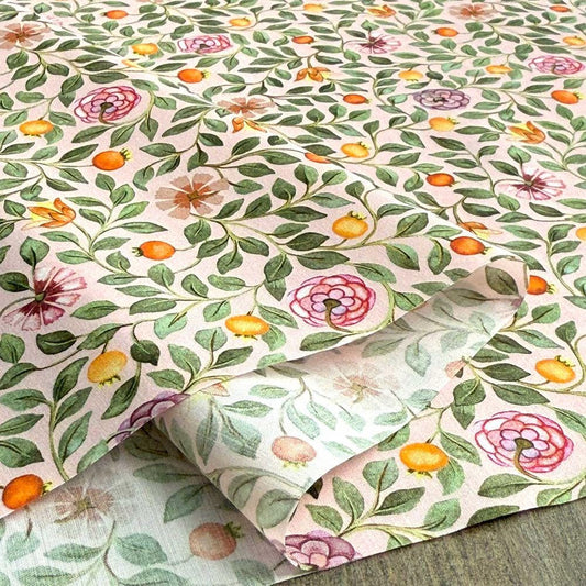 a close-up view of a fabric with a floral pattern. The fabric is adorned with green leaves, pink flowers, and orange fruits, creating a vibrant and colorful design. The pattern repeats across the fabric, adding a sense of rhythm and harmony to the overall composition.