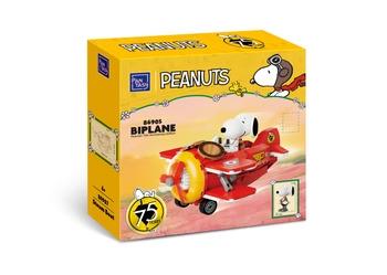 a toy airplane with a dog on top of it