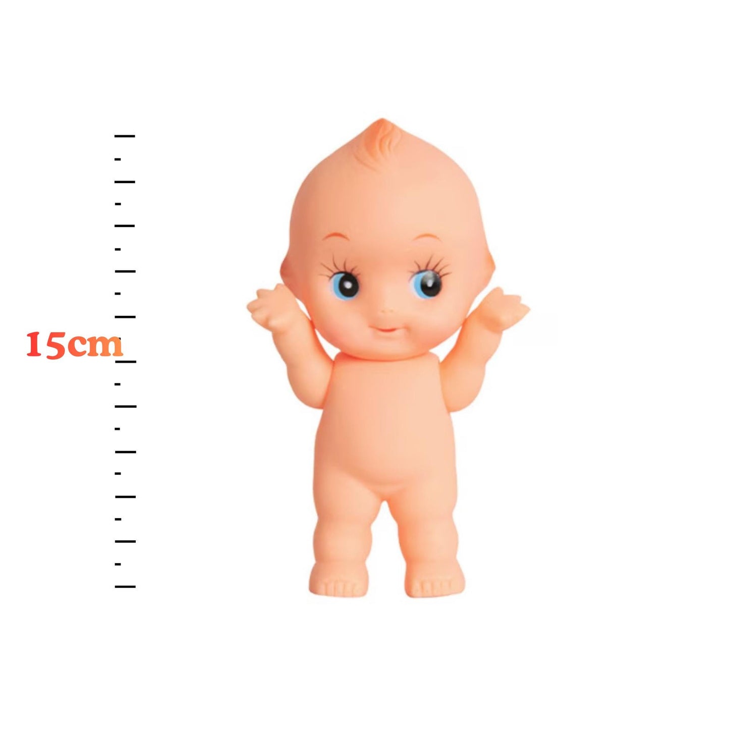 A toy doll with a smiling expression and blue eyes is shown next to a ruler indicating its size.