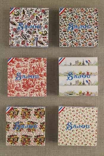 six different boxes with various patterns and designs, including floral, geometric, and abstract patterns. The boxes appear to be related to a brand or product, as they have the word "Saujour" written on them.