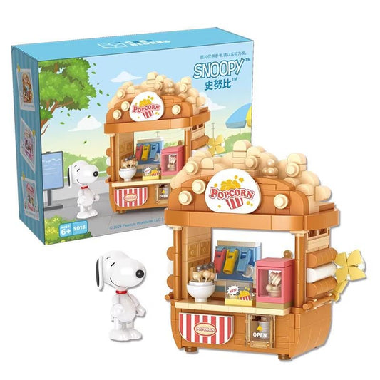 A set of building blocks depicting a Popcorn Palace, a popular character from the Peanuts comic strip. The set includes a Popcorn Palace toy and a small toy figure of Snoopy, the beloved character from the Peanuts series.