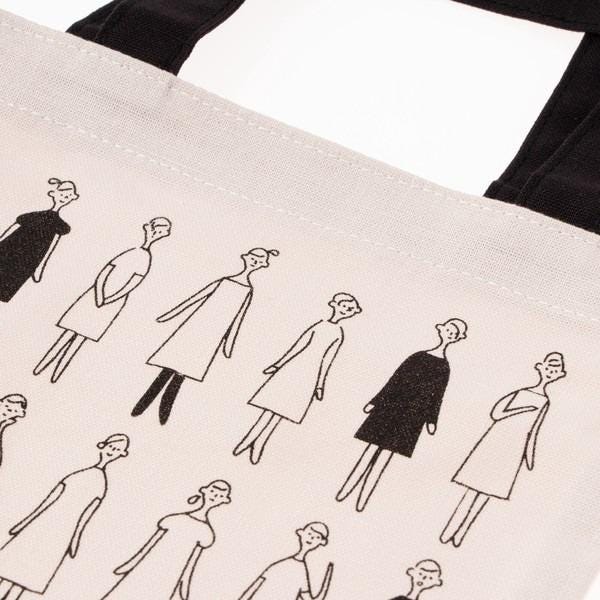 a tote bag with a repeating pattern of stylized human figures in various poses and outfits.