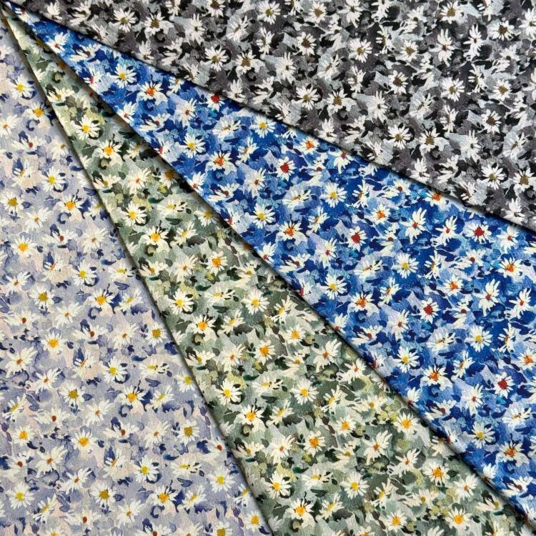 The image is a collage of various fabric swatches with different floral patterns, including white and yellow flowers, as well as a mix of blue, green, and gray floral designs.