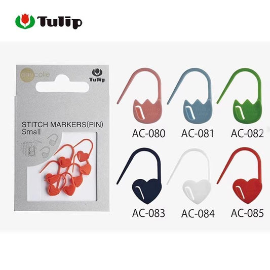 a package of Tulip Stitch Markers (Pin) in various colors, including red, blue, green, and white, alongside six different colored hooks.