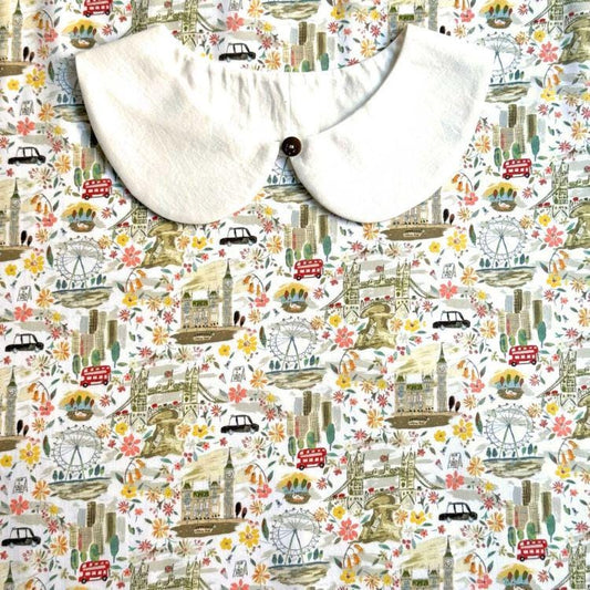 a collage of various illustrations of landmarks and scenes, including a large white collar, a ferris wheel, a London Bridge, and other iconic structures and scenes.
