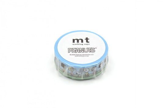 A blue and white circular object with the text "mt masking tape PEANUTS" printed on it.