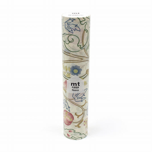 A cylindrical object with a floral pattern on it, featuring a white label with text.