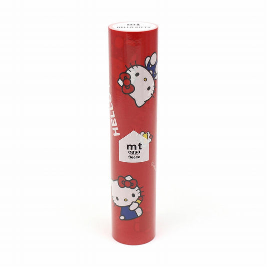 A red cylindrical object with a cartoon image of a Hello Kitty character on it.