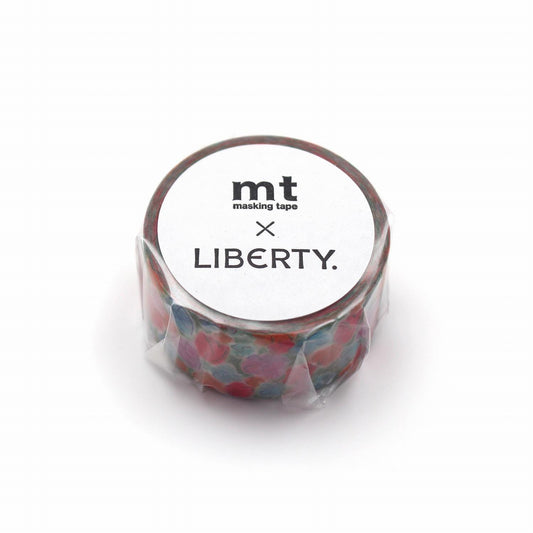 A round, white, and colorful masking tape roll with the text "mt masking tape LIBERTY" printed on it.