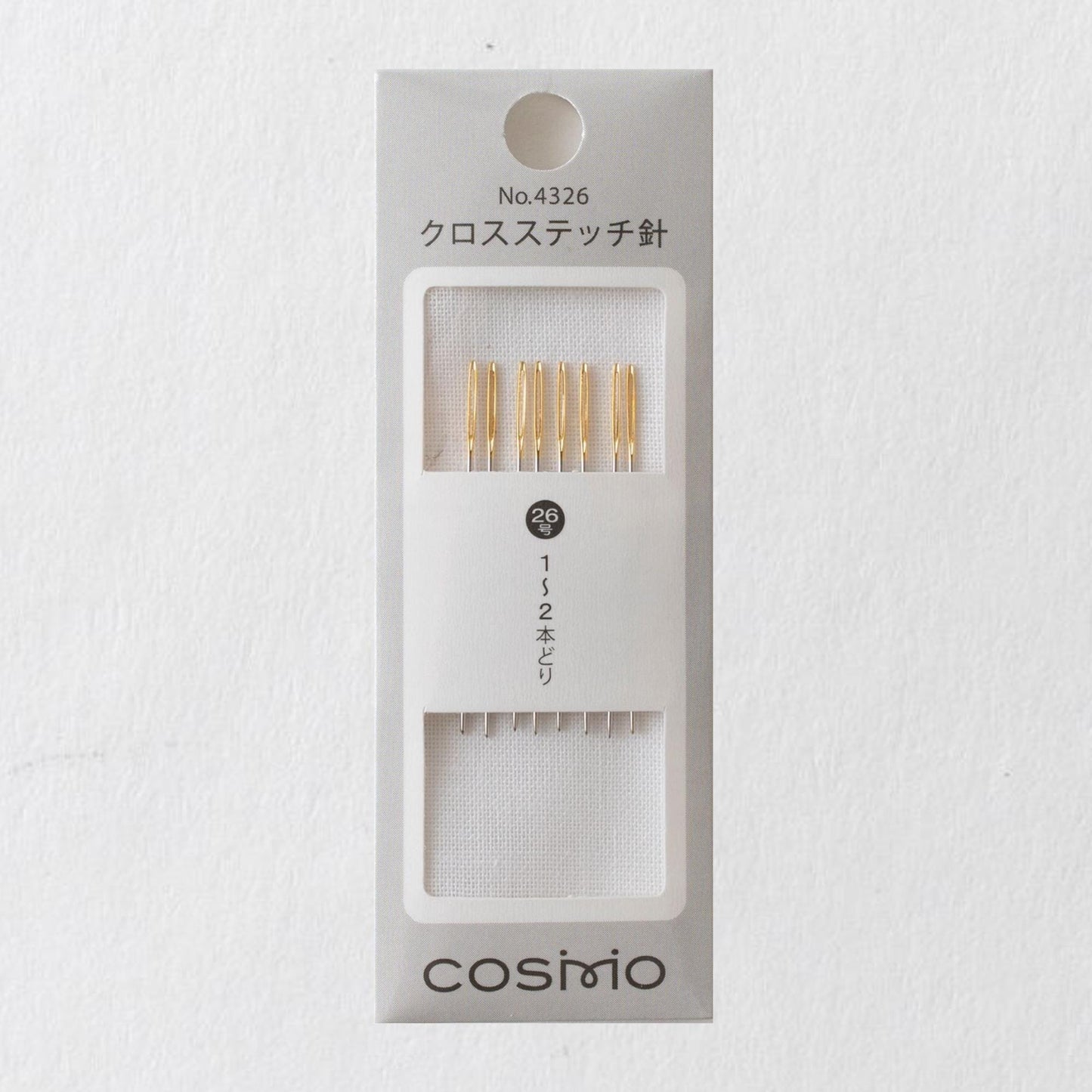 A package of knitting needles with gold tips, labeled as "No.4326" and "コスポーネンドレッソ" (COSMIO).