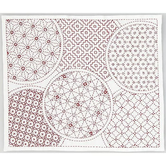 The image is a collage of various circular patterns and designs, featuring a mix of geometric and floral motifs. The patterns include a variety of shapes, such as circles, ovals, and diamonds, as well as floral elements like flowers and leaves. The overall composition creates a visually interesting and diverse display of circular designs.