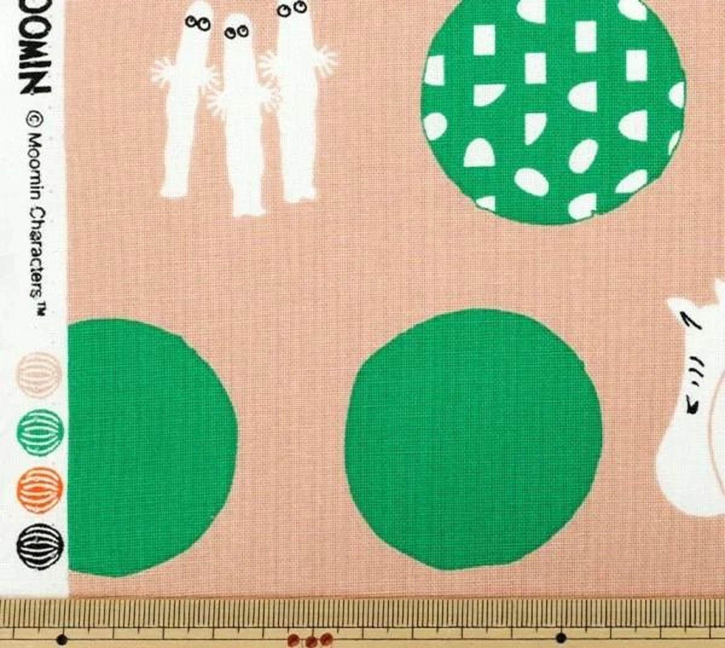 The image is a fabric with various abstract shapes and designs, including circles, lines, and other geometric patterns.