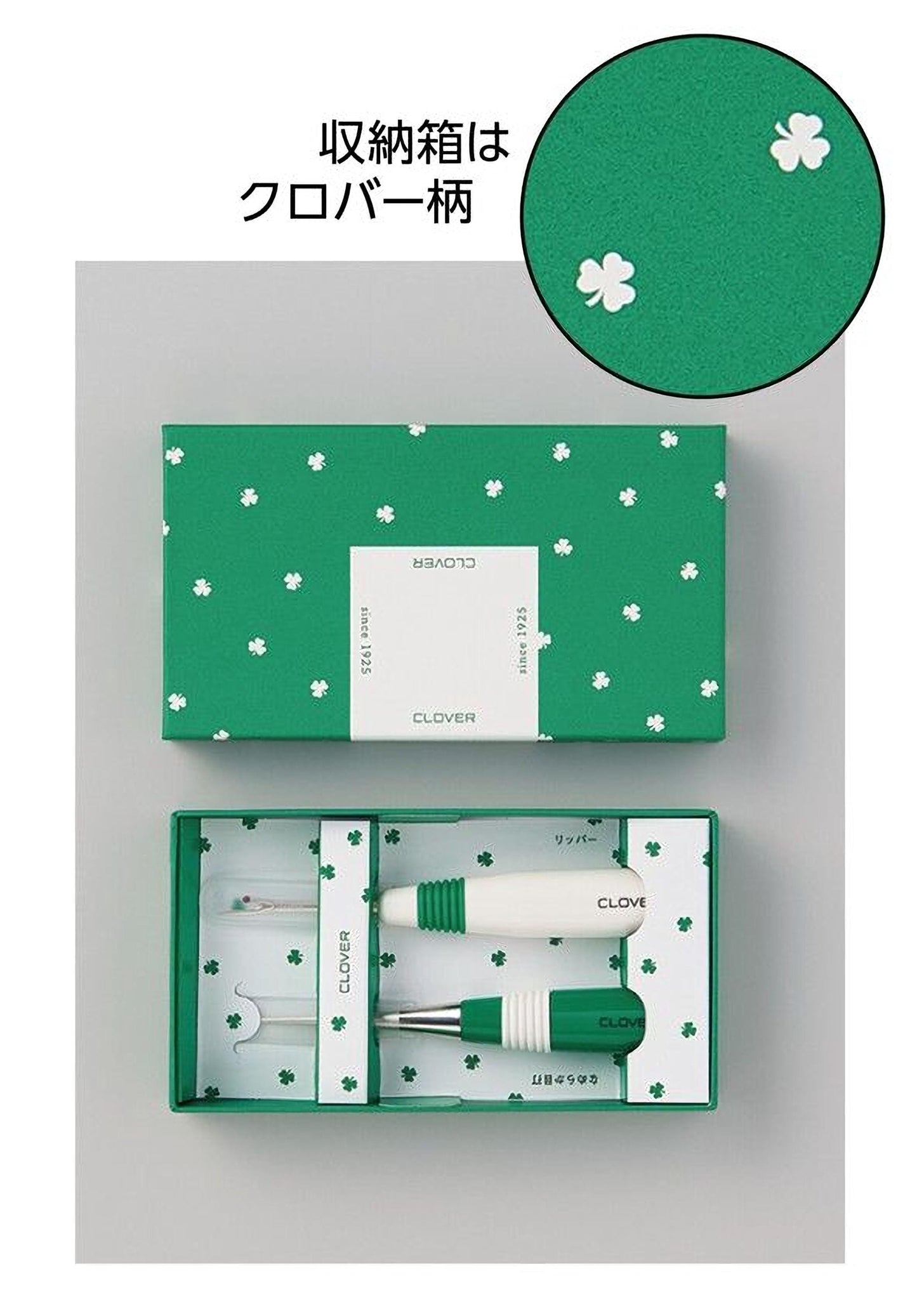 a green box with white clover designs, and inside the box are two green and white clover-themed items.