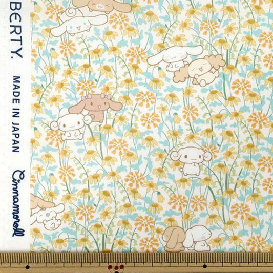 a fabric with a dog and flowers on it