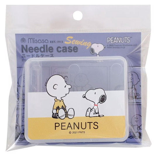 A sewing kit featuring a cartoon image of the Peanuts characters, including Snoopy and Charlie Brown, along with the text "Peanuts" and "Sewing".