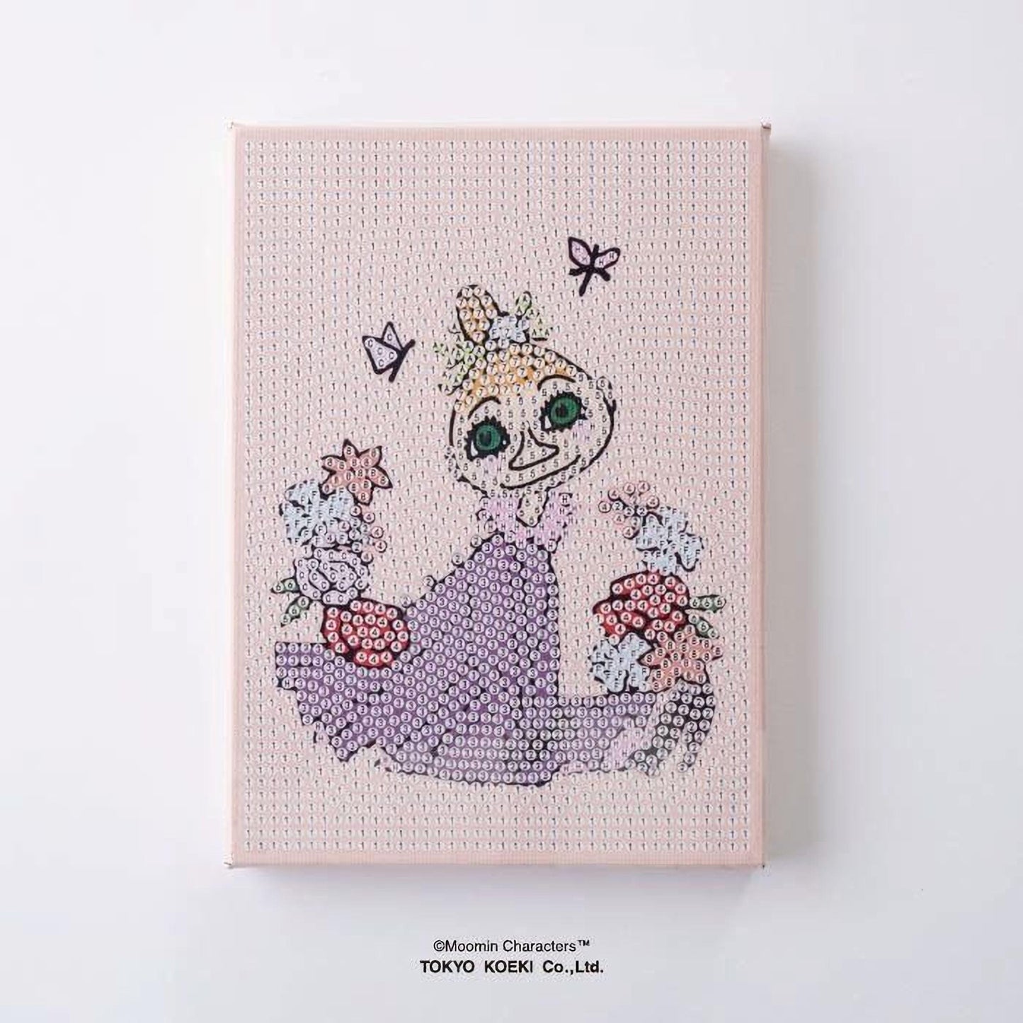 The image is a pink canvas featuring a cartoon-like illustration of a girl with a flower crown and butterflies.