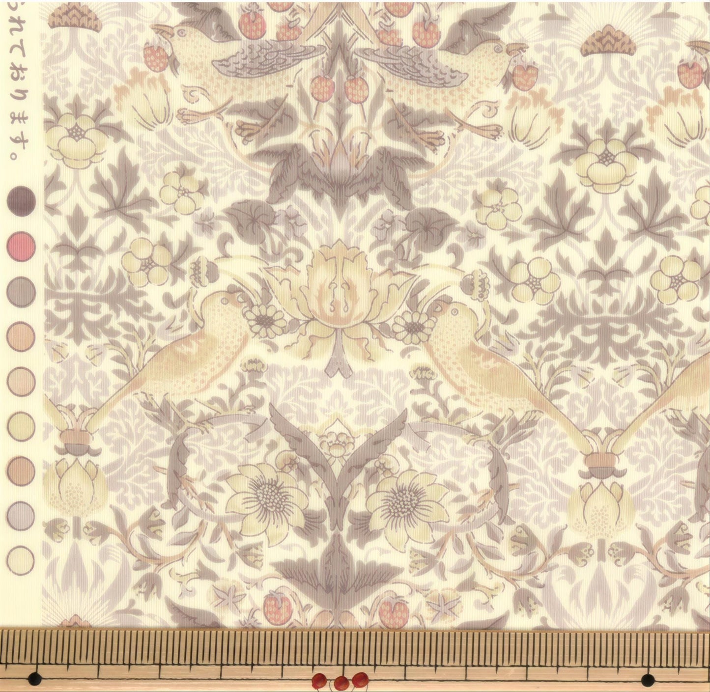 The image is a close-up of a fabric with a repeating floral pattern, featuring birds and flowers in shades of pink, white, and beige.