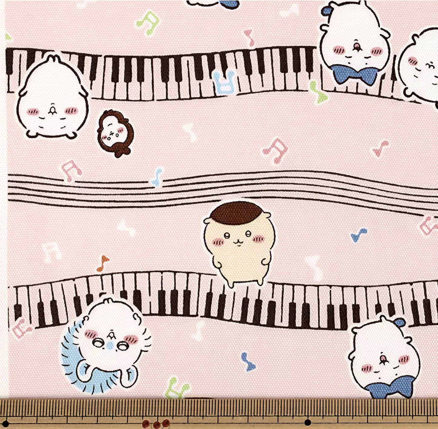 a pink background with various cartoon-style animal characters, including a cat, a dog, and a bird, along with musical notes and a piano keyboard.