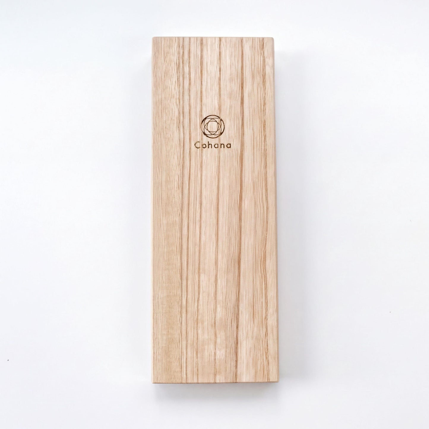 A wooden rectangular object with a logo on it, placed against a white background.
