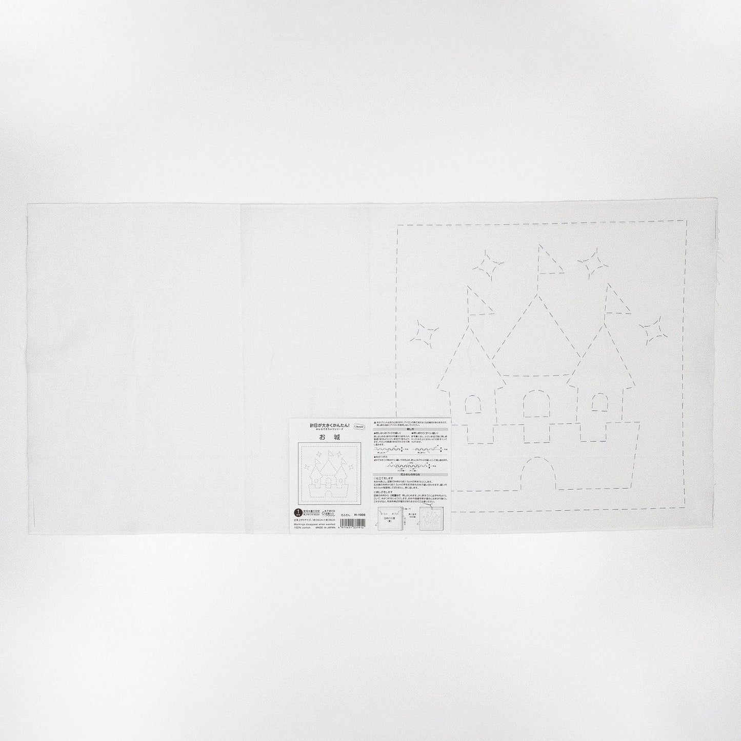 The image is a black and white illustration of a castle, with a detailed drawing of the castle and stars surrounding it.