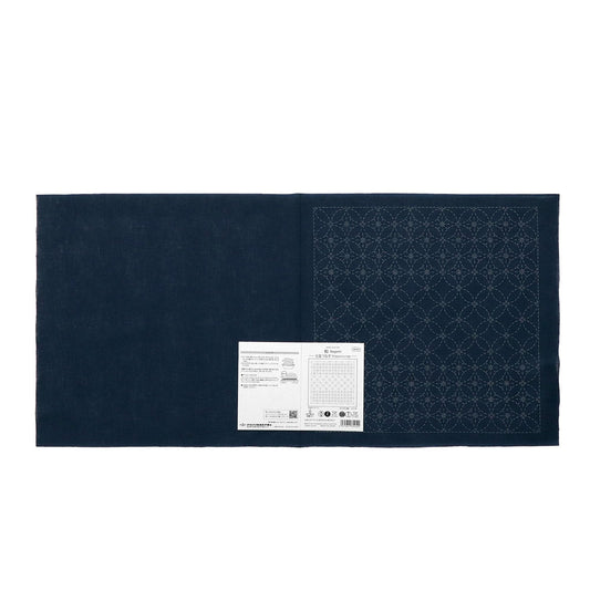 The image is a dark blue fabric with a white label attached to it, which appears to be a sewing or crafting material.