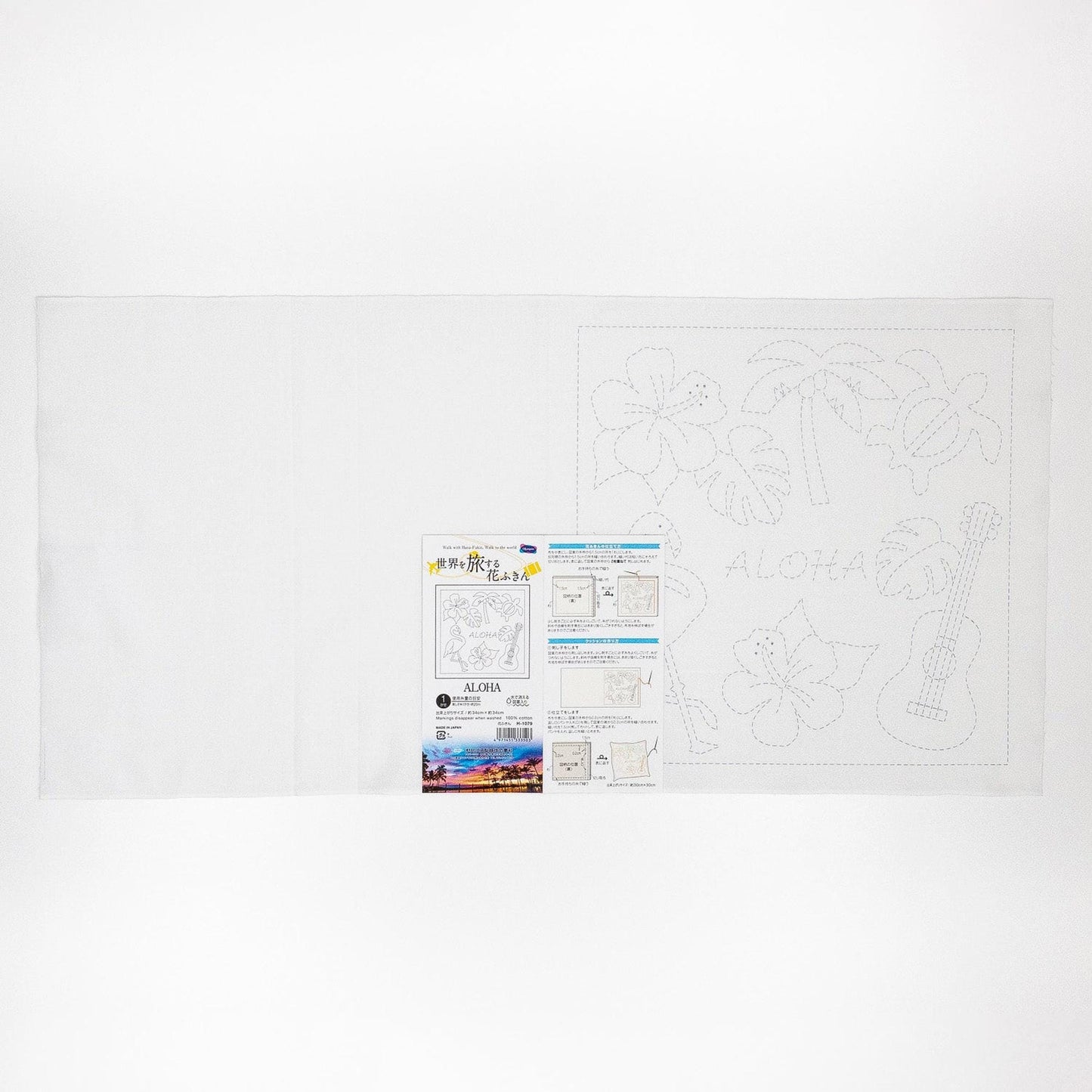 The image is a white sheet of paper with various drawings and text, including a large drawing of a guitar and the word "ALOHA" written on it.