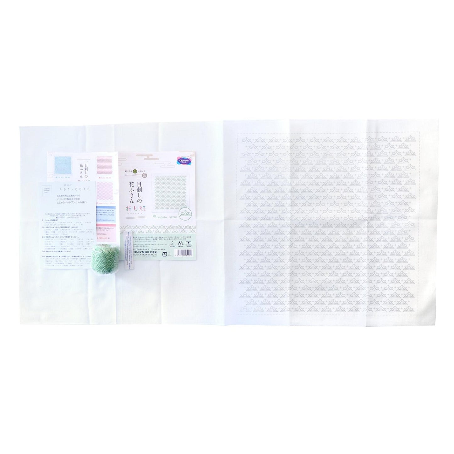 various items, including a ball of yarn, a piece of paper with a pattern, and some text. The text appears to be in Japanese, and it is not possible to provide a detailed description of each item or phrase without repetition. The image is not a collage of multiple images, and there are no specific actions or movements depicted.
