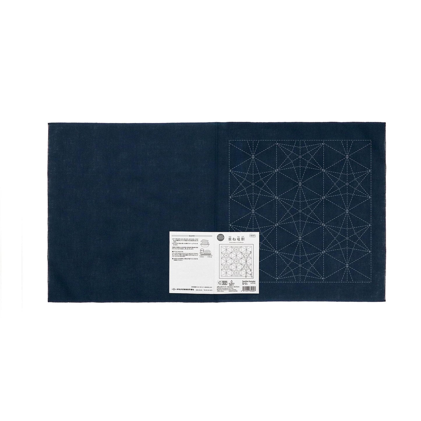 The image is a dark blue fabric with a white geometric pattern on it.