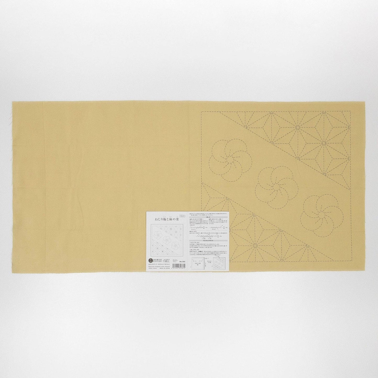 The image is a large piece of paper with a printed pattern or design on it, along with some text and a barcode.