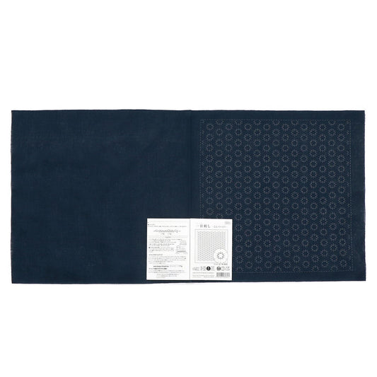 The image is a dark blue fabric with a white label placed on it.