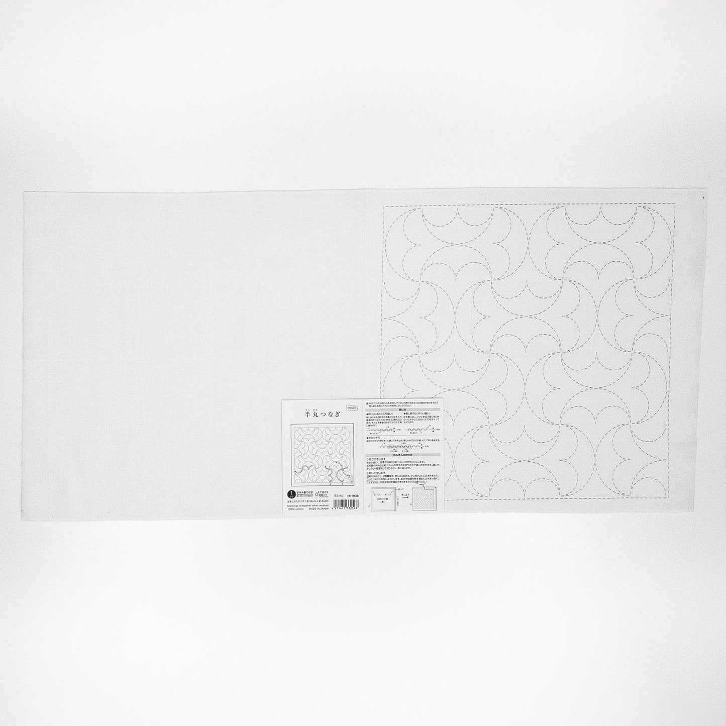 The image is a white sheet of paper with a pattern or design on it, along with some text and a barcode.