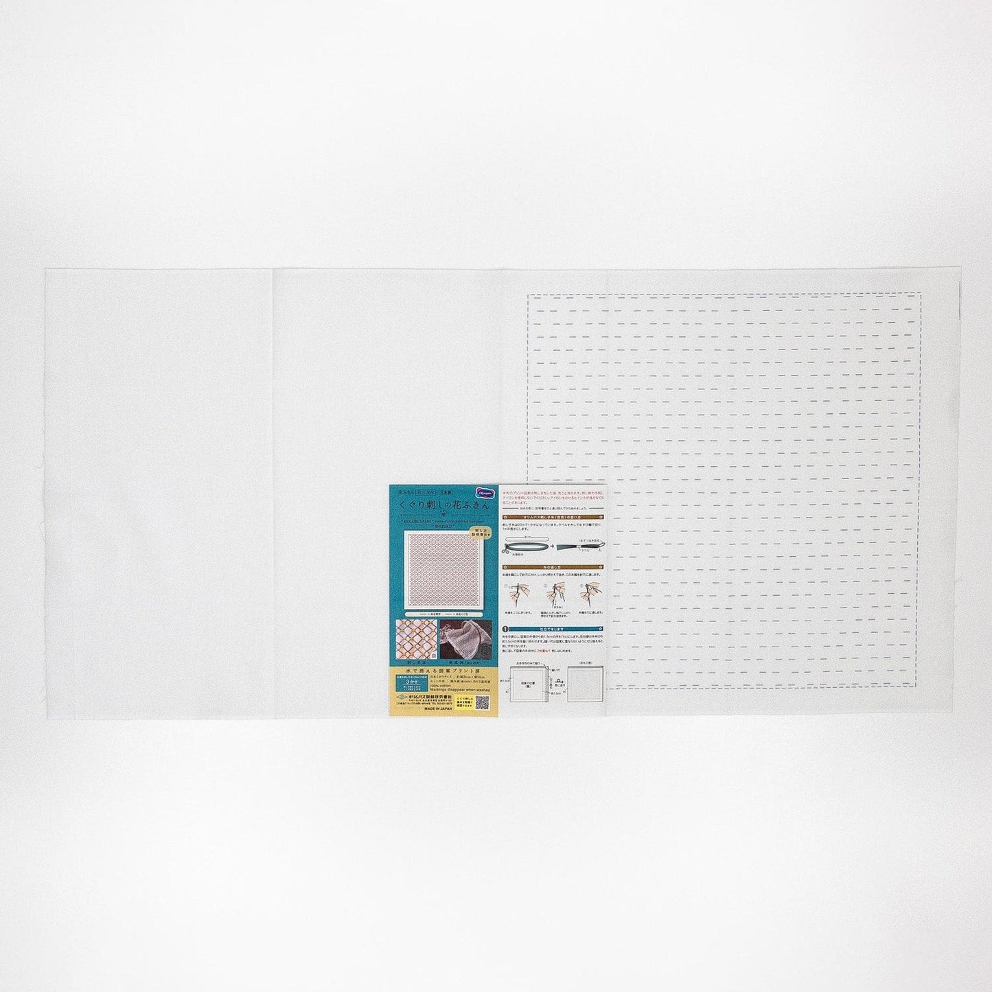 The image is a plain white background with a small piece of paper or card attached to it, containing text and images.