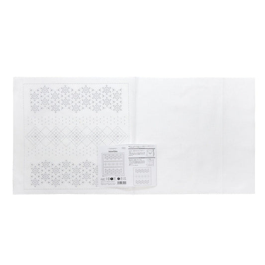 The image is a white sheet of paper with a pattern of snowflakes on it.