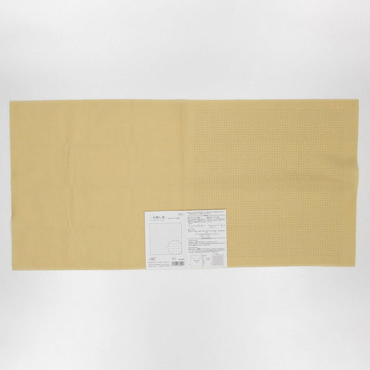 The image is a plain, light-colored fabric with a label attached to it, which appears to be a piece of paper or a printed document.