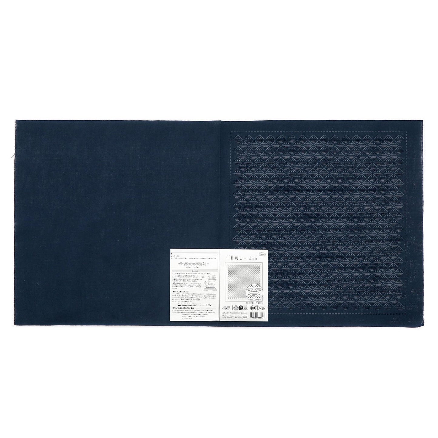 The image is a dark blue fabric with a white label attached to it, which appears to be a product label or instructions.