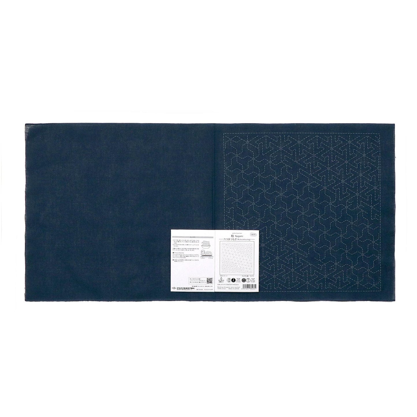 The image is a dark blue fabric with a white label attached to it, which appears to be a piece of paper or a printed document.