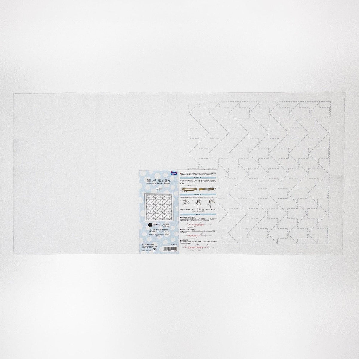The image is a white sheet of paper with a pattern or design on it, along with a label or instructions for the pattern.