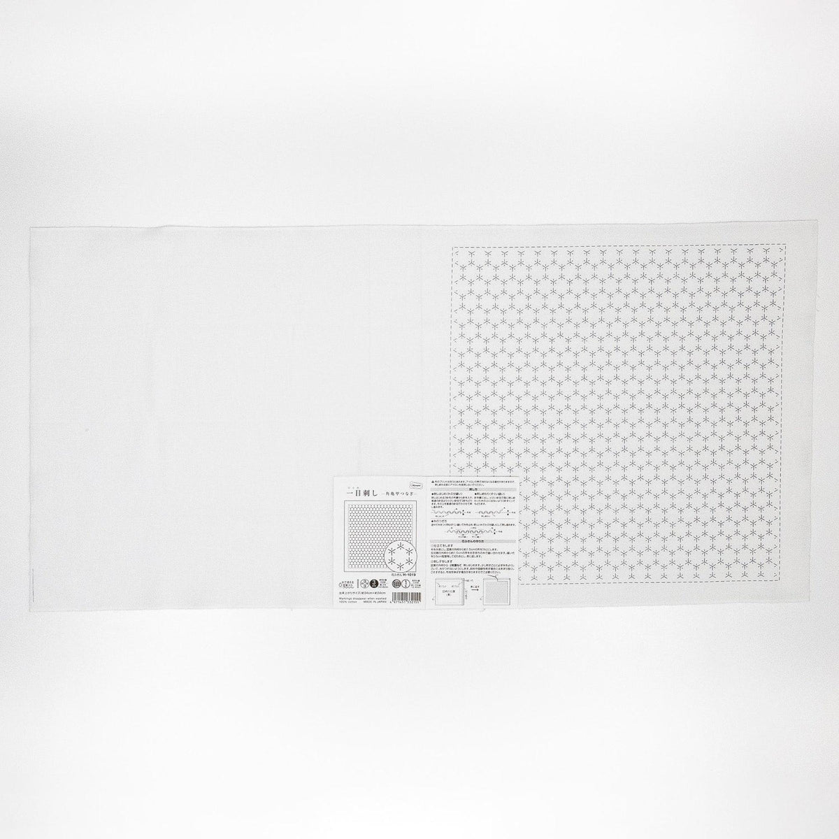 The image is a plain white sheet of paper with a patterned square design on it.