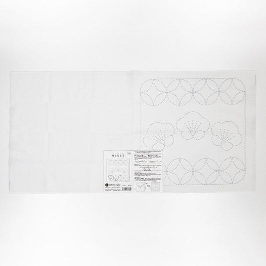 The image is a white sheet of paper with a detailed embroidery design and instructions for a sewing project.