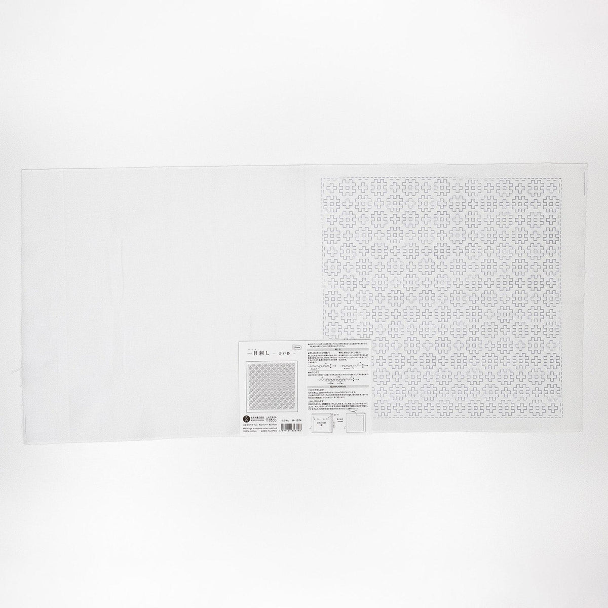 The image is a plain white surface with a patterned square on the right side. There is a small label or text on the right side of the image, but it is not clear enough to transcribe accurately.