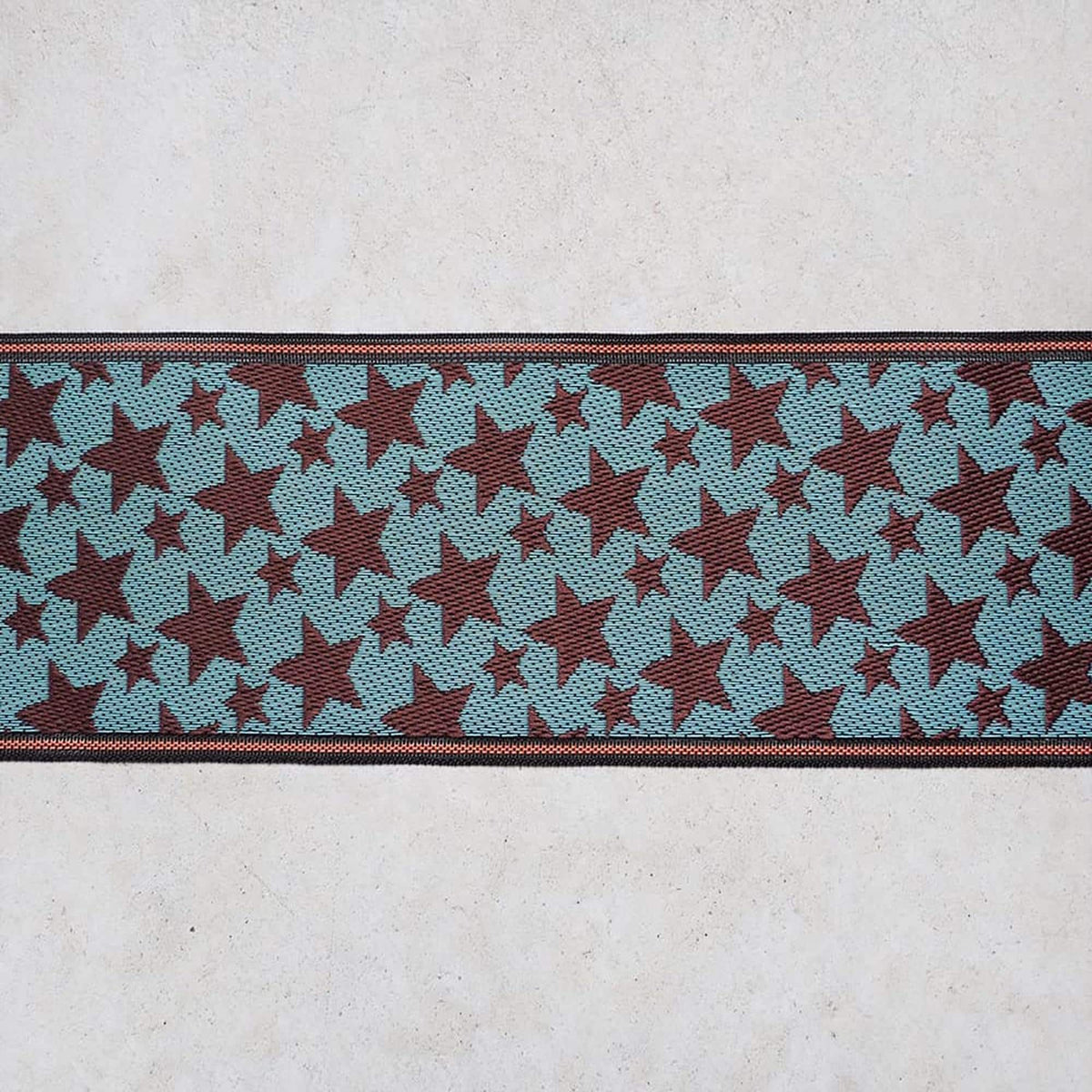 a repeating pattern of red and blue stars on a white background.