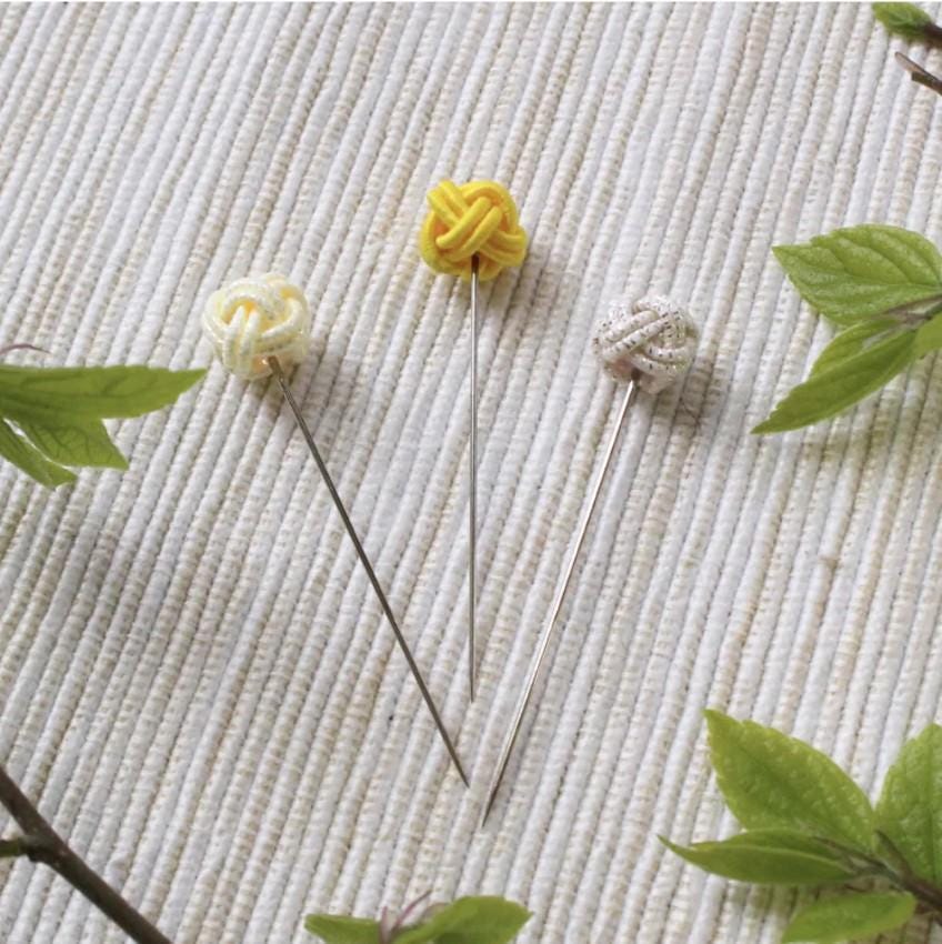 a group of pins sitting on top of a table