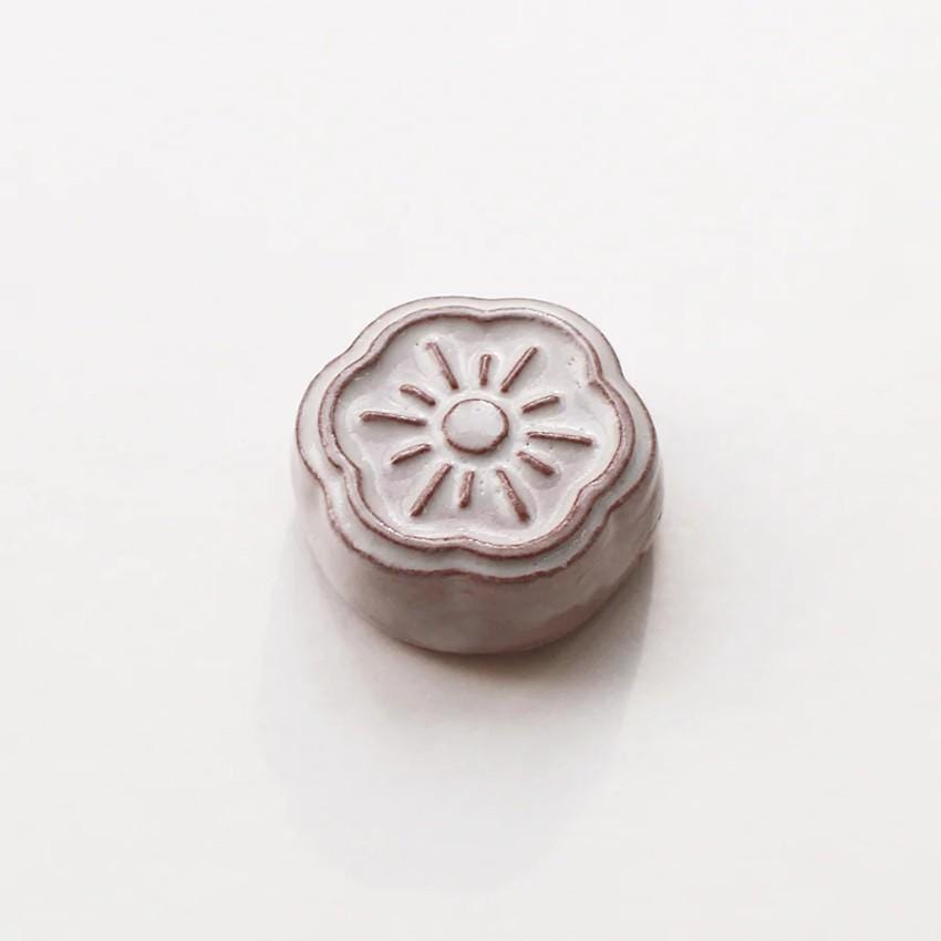 a small white object sitting on top of a table