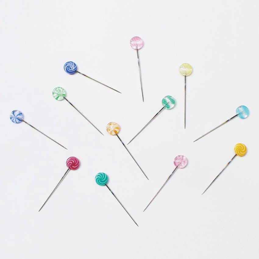a group of pins sitting on top of each other