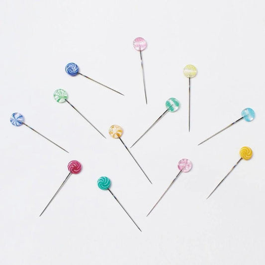 a group of pins sitting on top of each other