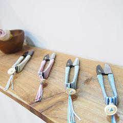 a wooden table topped with different types of utensils