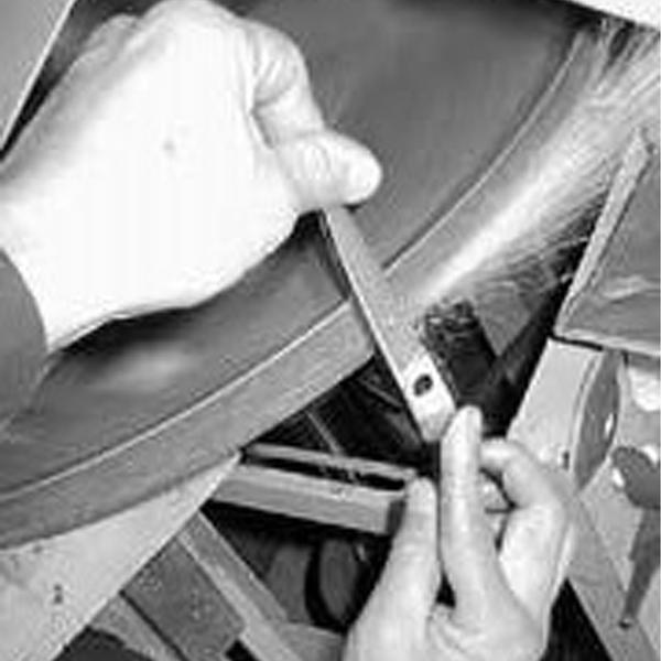 a person cutting something with a pair of scissors