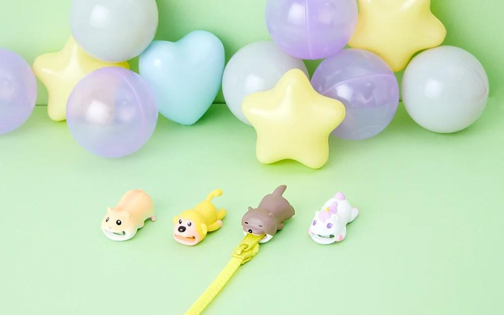 a bunch of balloons and some toys on a table