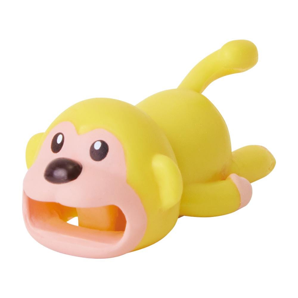a yellow and pink toy animal laying on its side